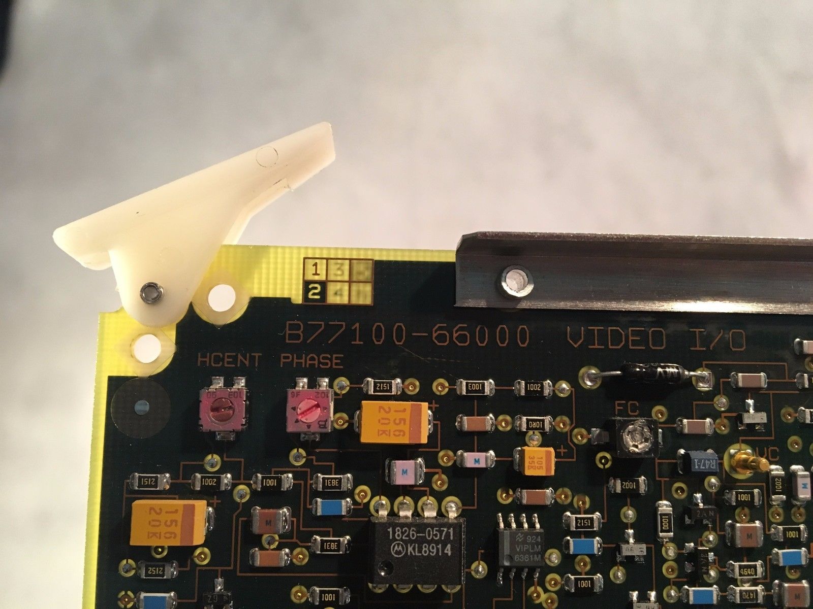 a close up of a circuit board with a white object on top of it