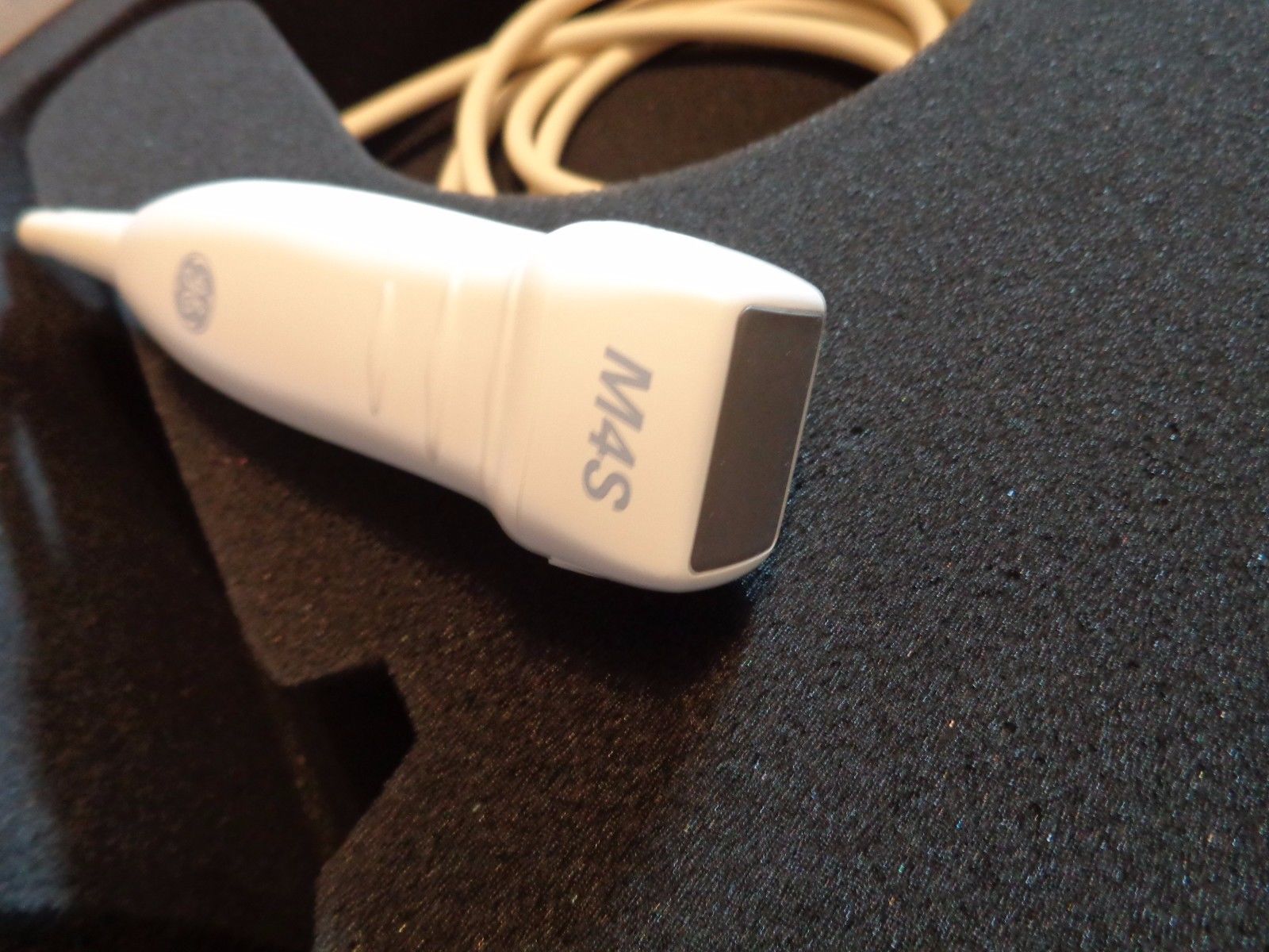 a close up of a probe connected to a device