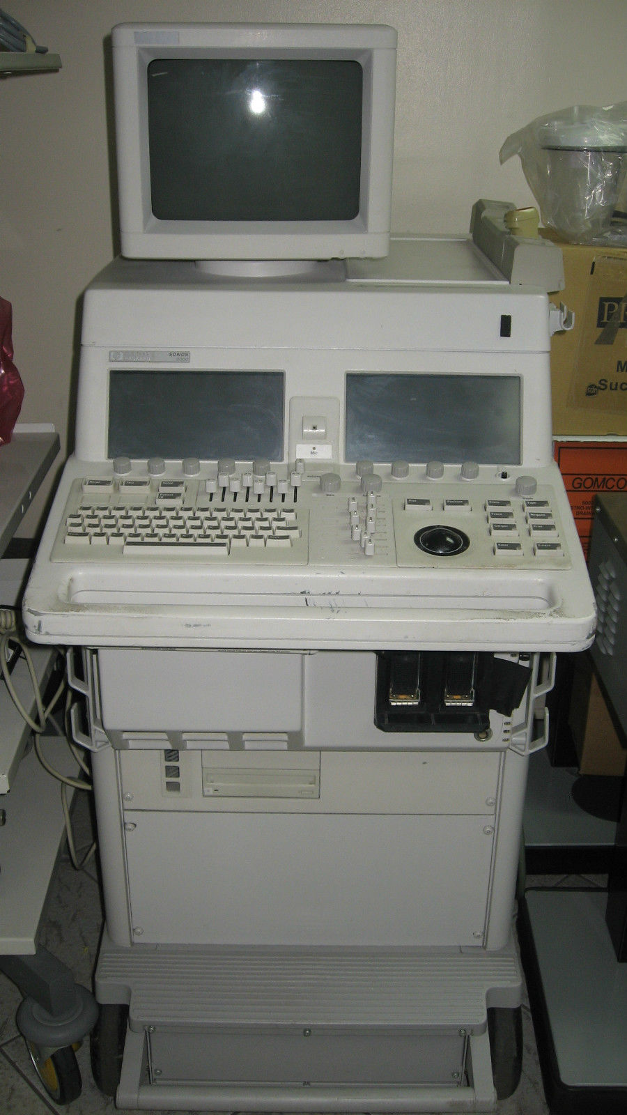 a computer sitting on top of a white desk