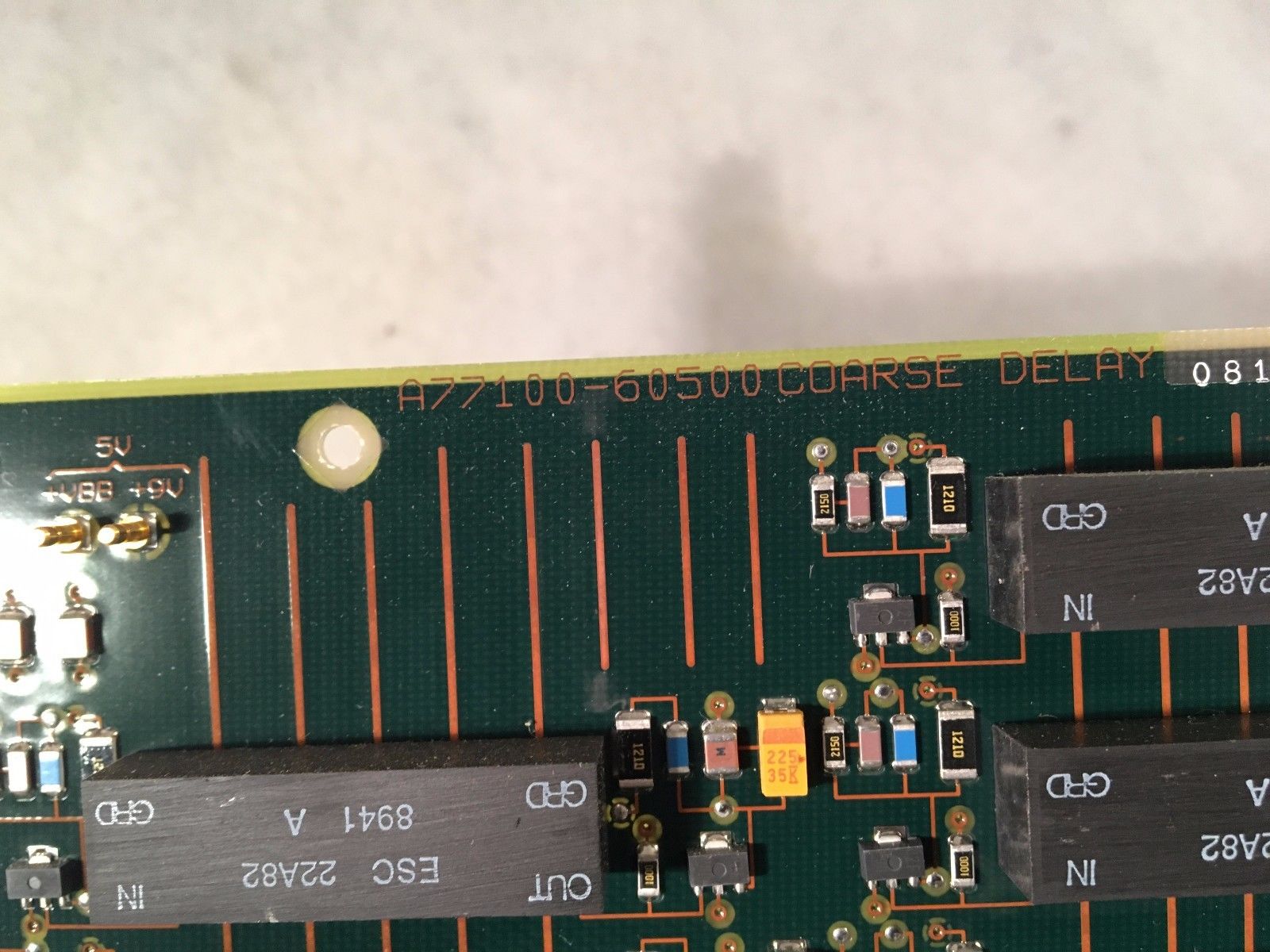 a close up of a circuit board with many wires