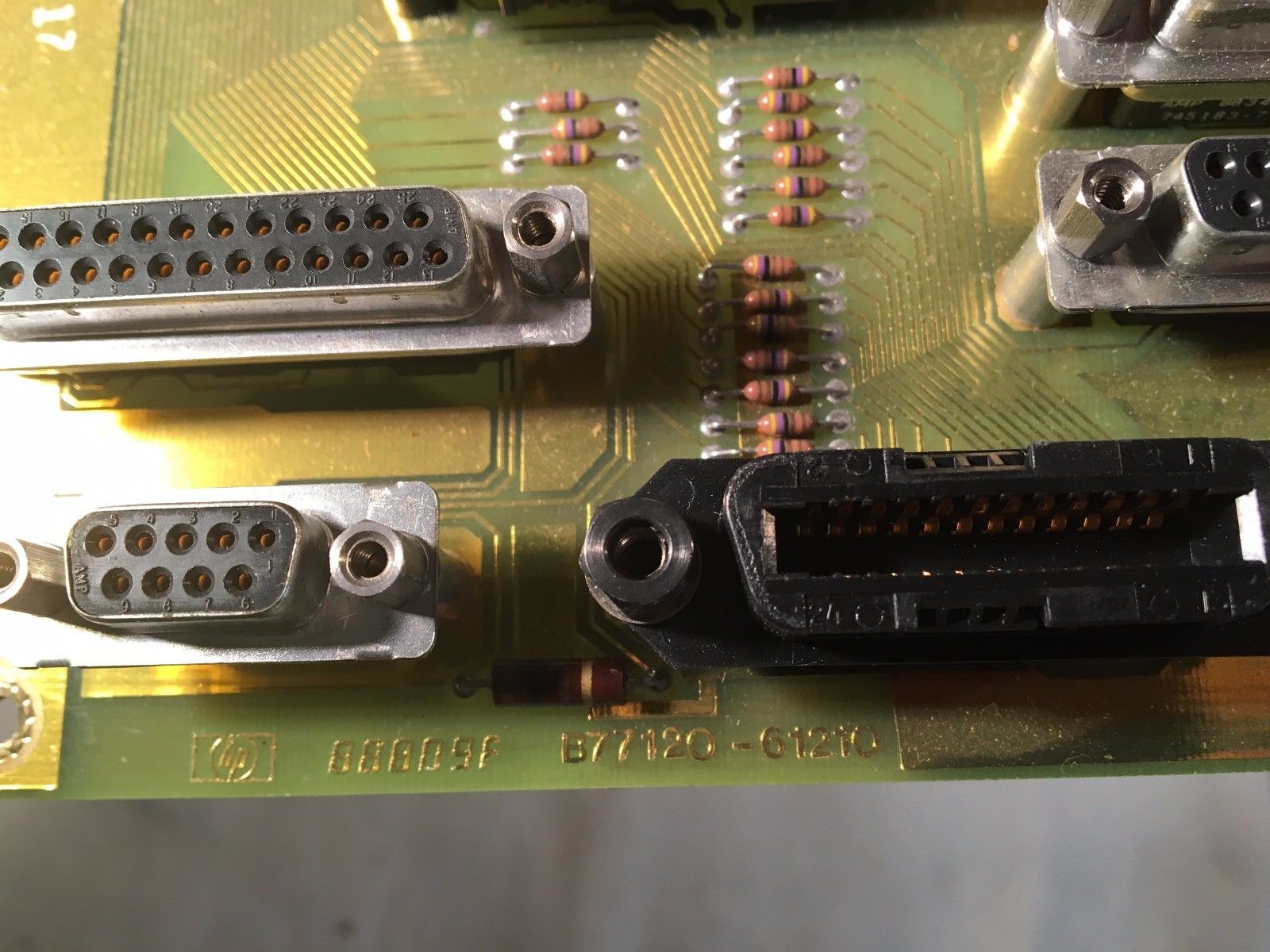 a close up of a computer board with wires and connectors