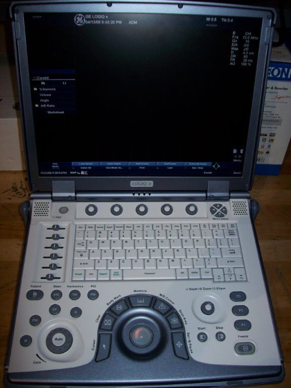 ultrasound sitting on top of a wooden table