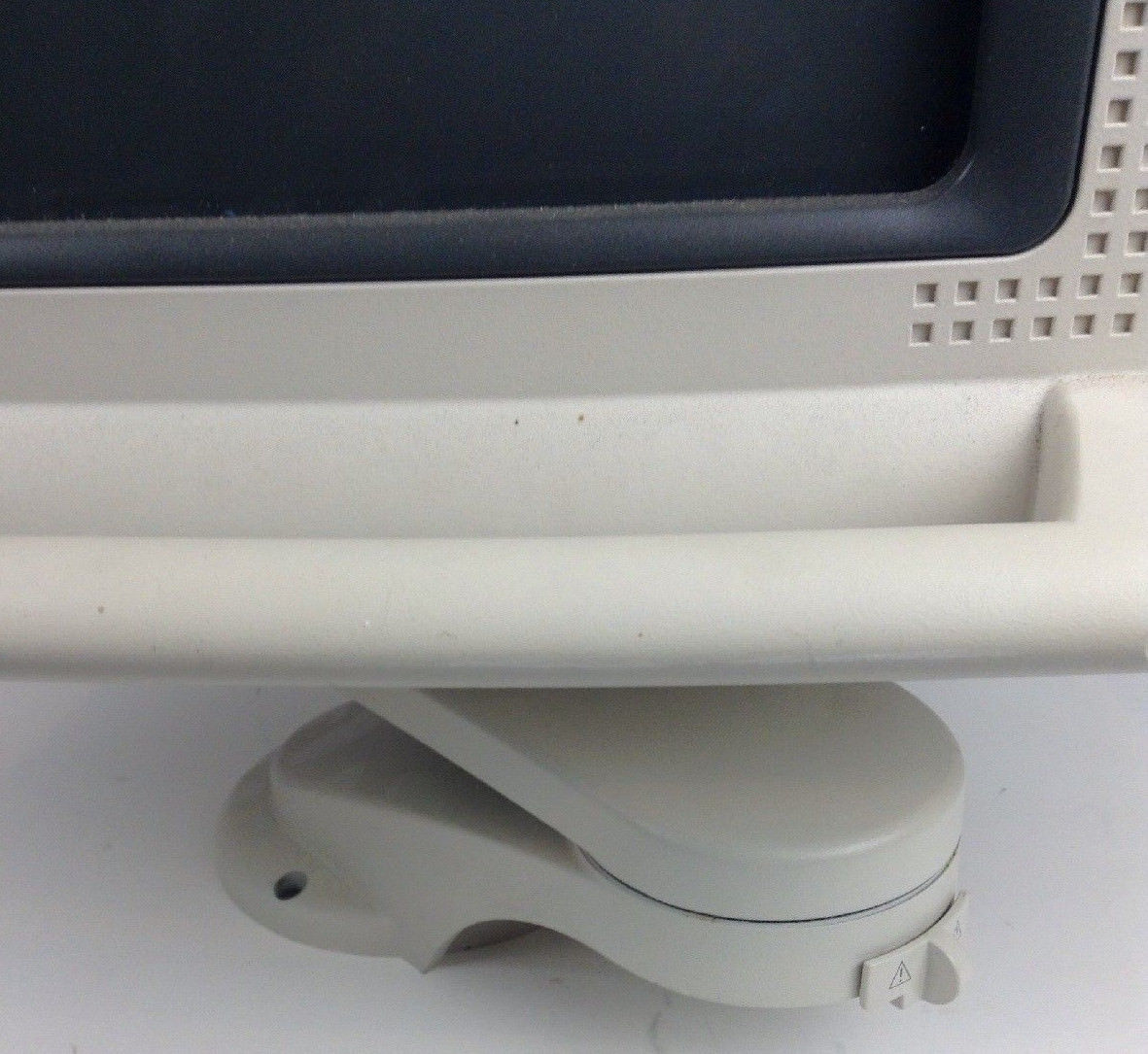 a computer monitor sitting on top of a white table
