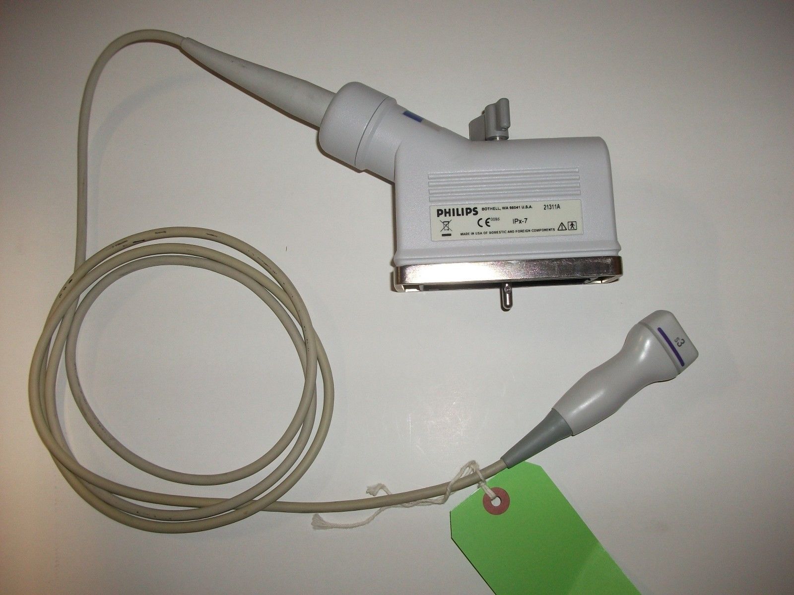 a close up of a probe head green tag