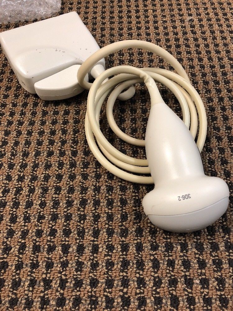 a corded device laying on a carpet 