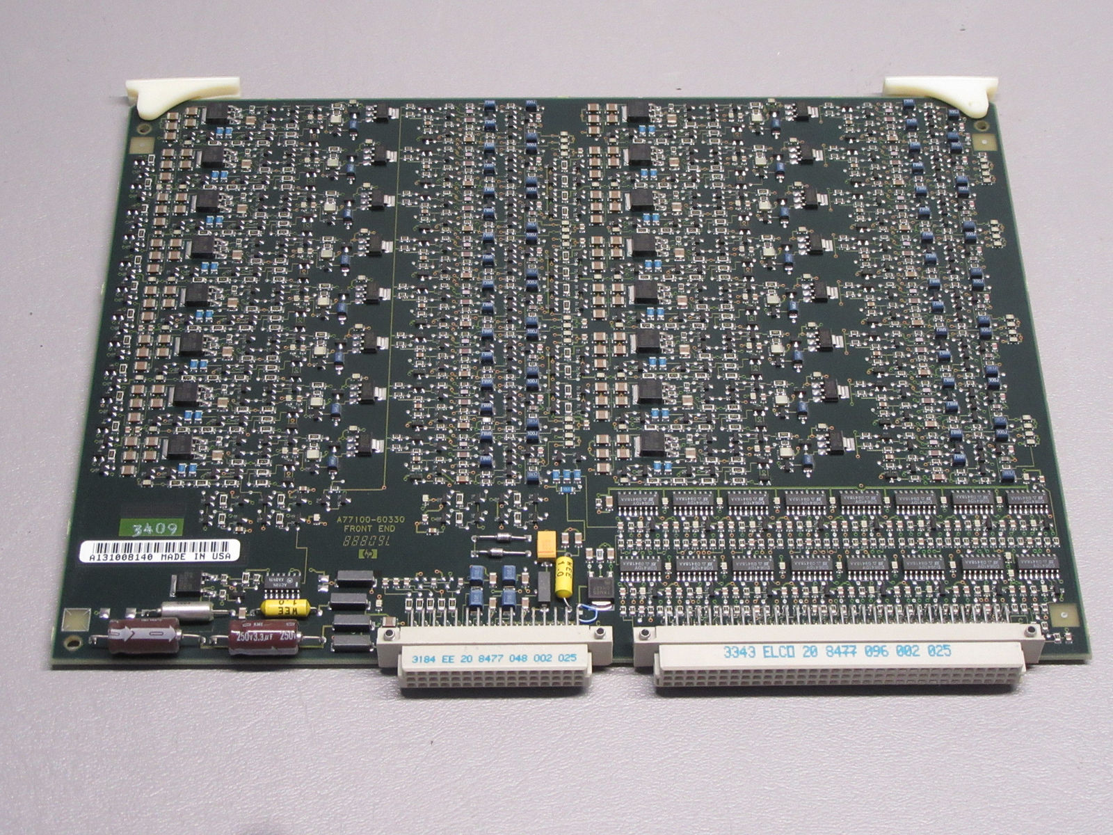 a close up of a computer board with many wires