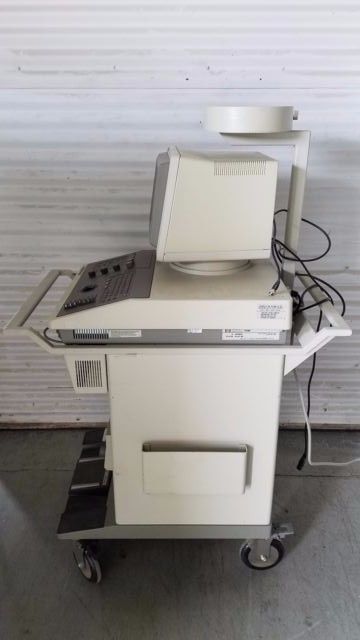 a computer sitting on top of a cart