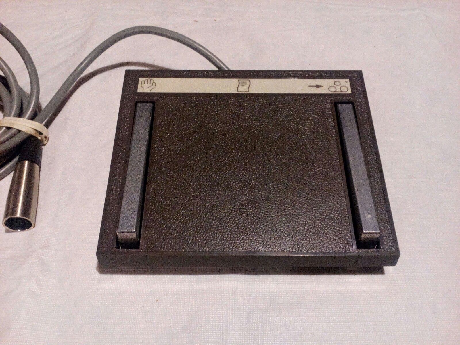 a black electronic device with two wires connected to it