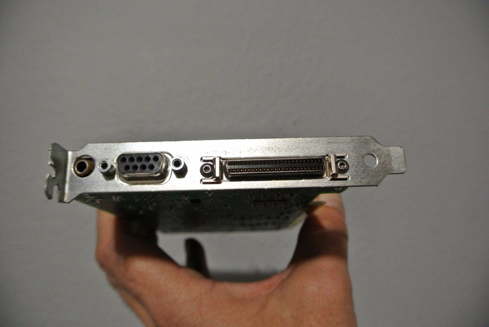 a close up of a person holding a metal device