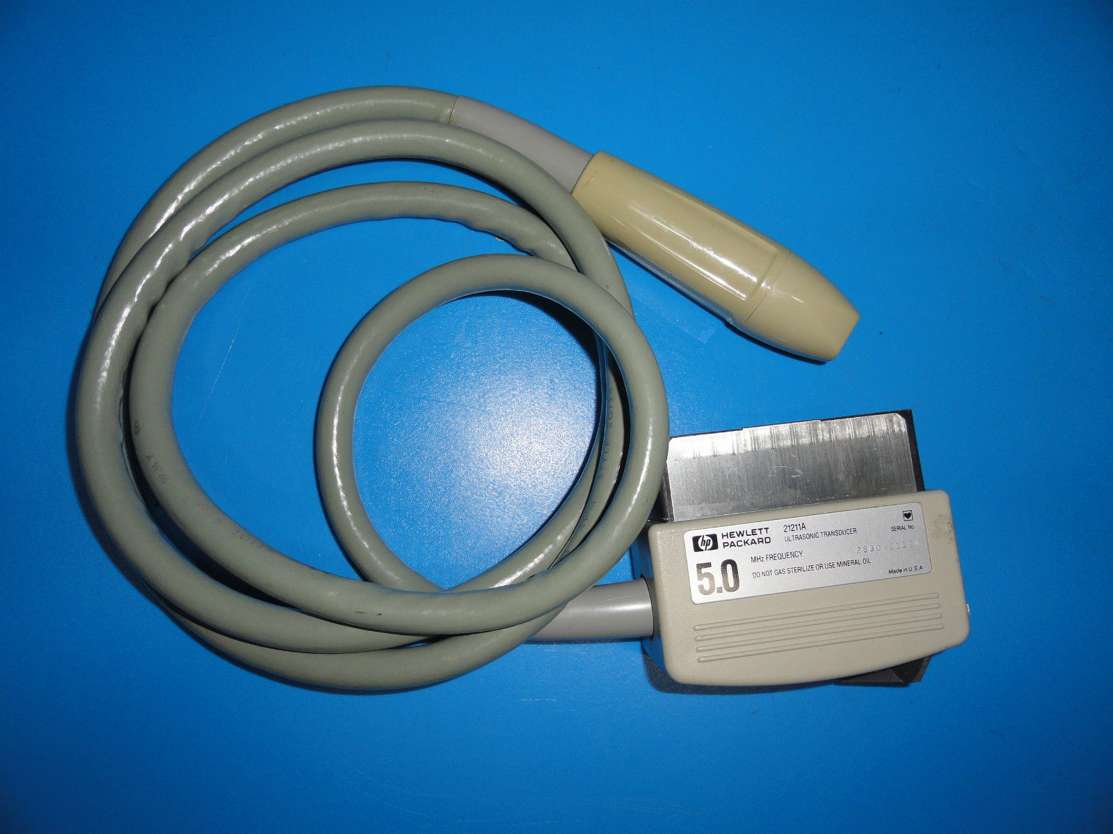 cable connected to a device on a blue surface