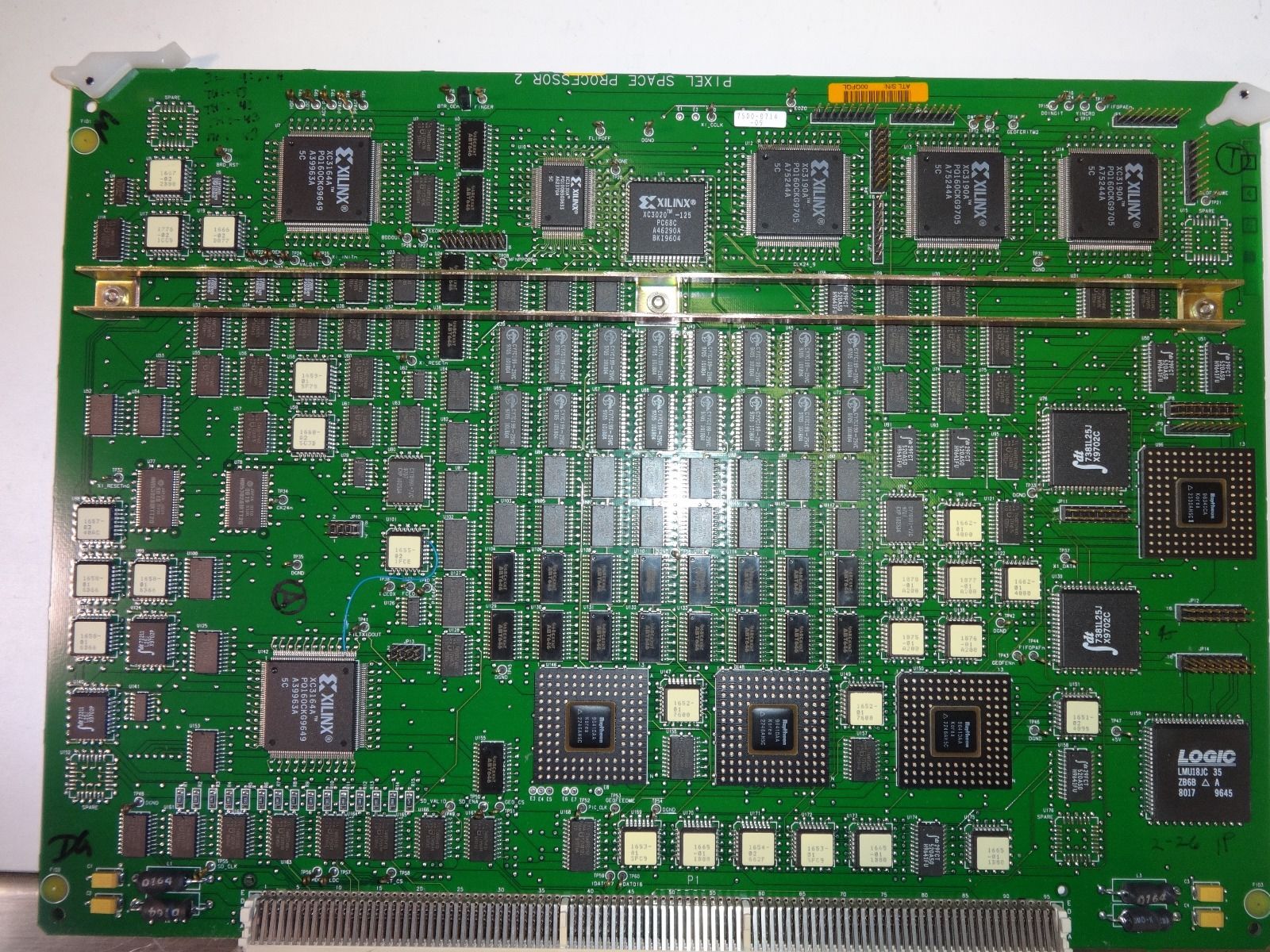 a close up of a green electronic board