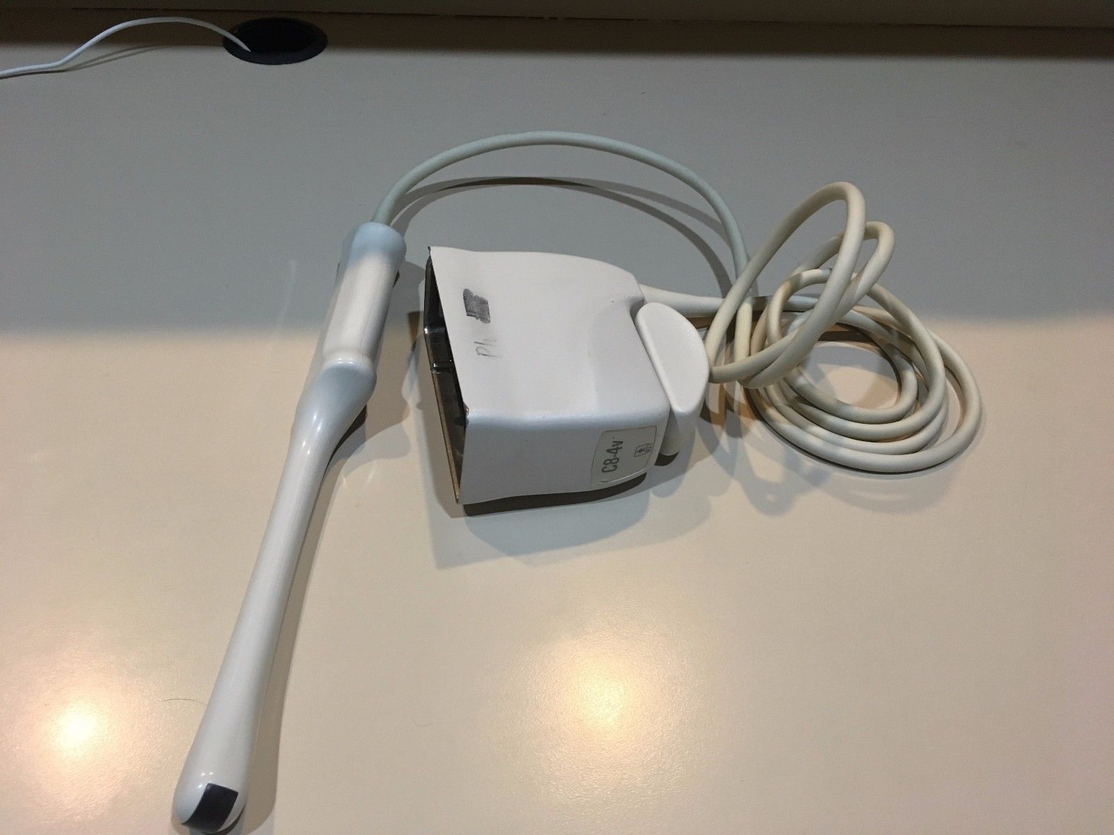 a cord connected to a probe on a table