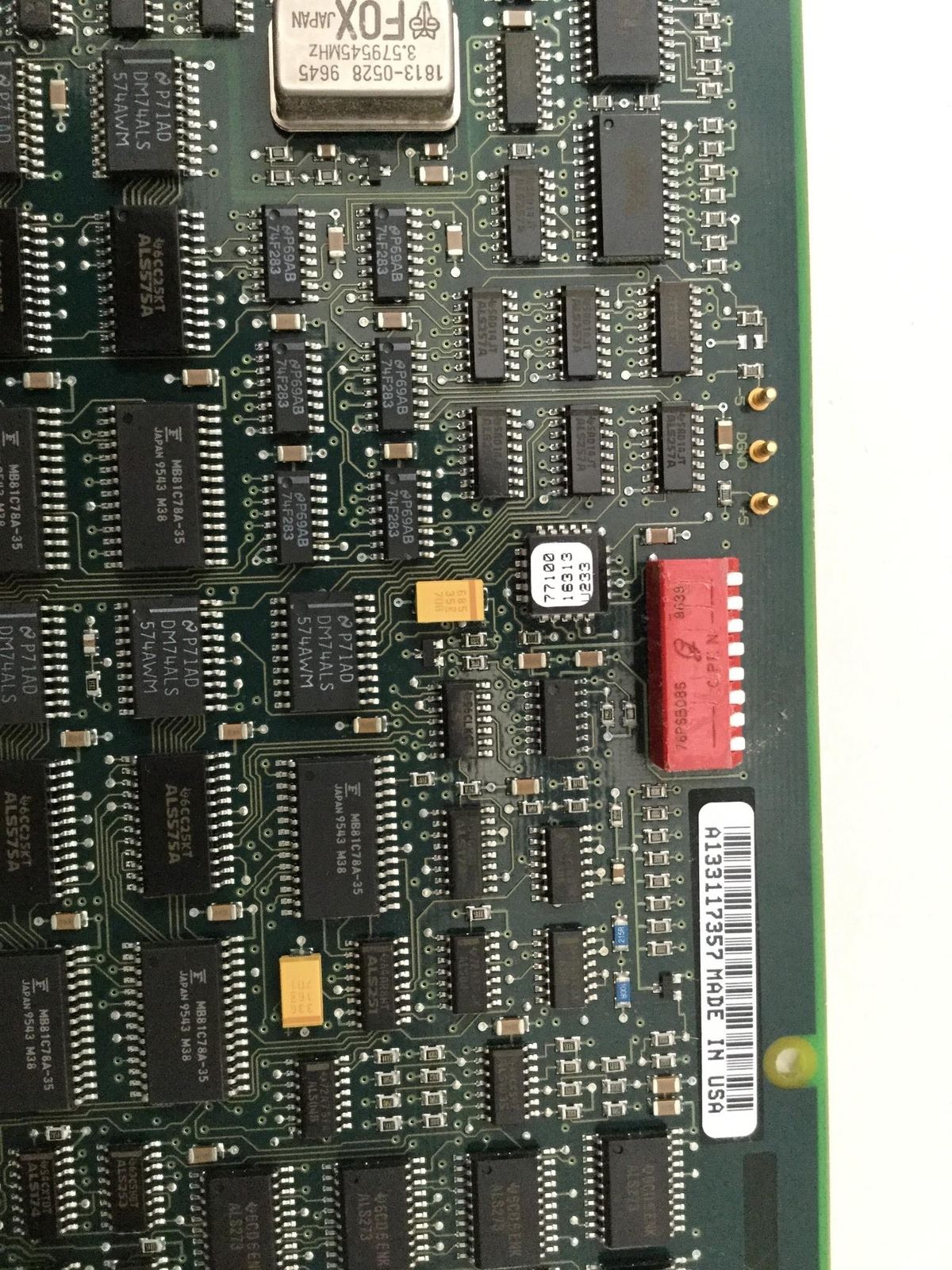 a close up of a computer board with many electronic components