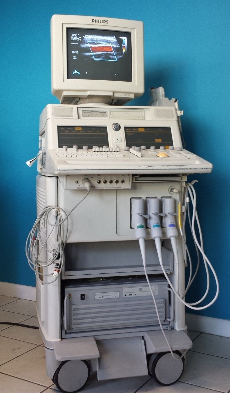 a medical machine sitting on top of a tiled floor