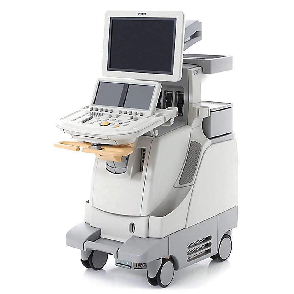 a medical machine with a laptop on top of it