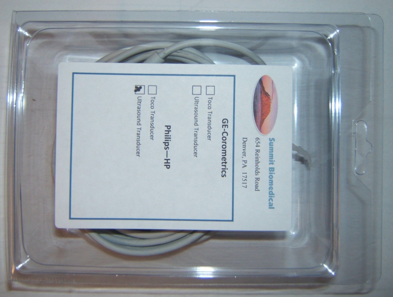 a white cord in a package on a table