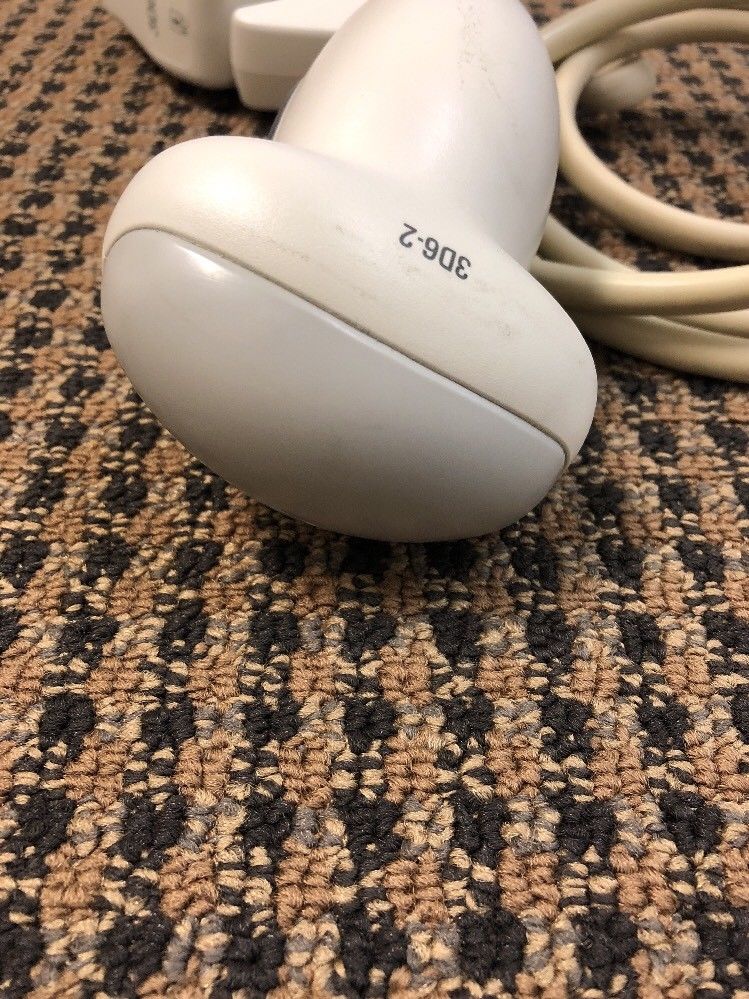 a close up of a white object on a carpet